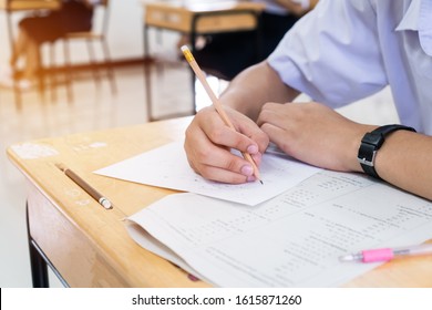 asian-students-holding-pencil-hand-260nw-1615871260.jpg